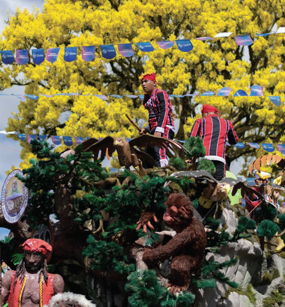 Musicians aboard the floats play against a backdrop of golden blooms